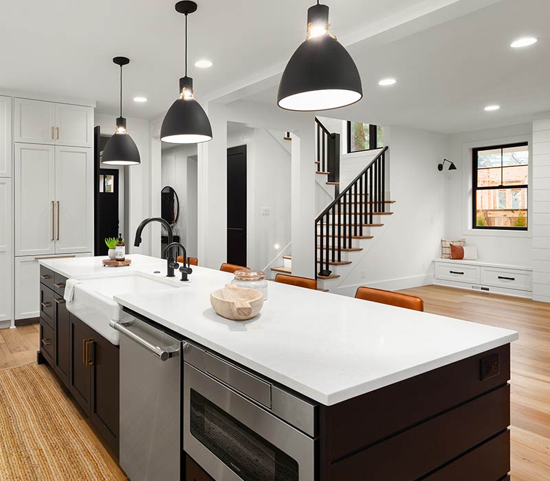 Modern kitchen with pendant and downlight lighting